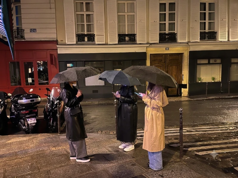Rainy Day in Paris? 10 Amazing Indoor Spots You Can’t Miss! three girls in Paris with umbrellas